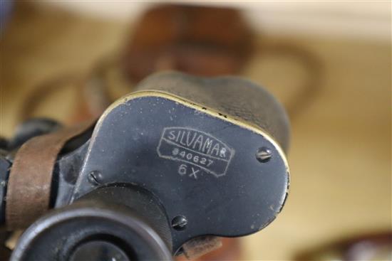 A set of leather-cased flasks, two pairs of binoculars, two spirit flasks and a set of leather-cased plated tumblers
